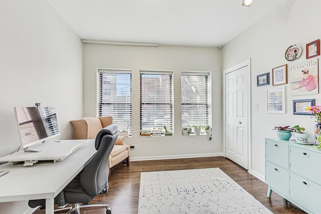 office area featuring dark wood-style floors and baseboards