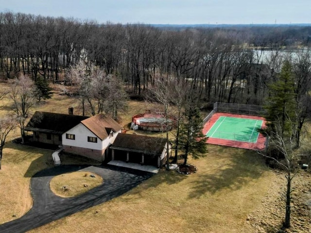 bird's eye view featuring a wooded view