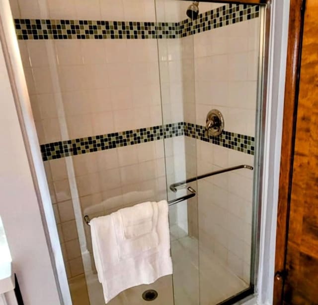 bathroom with a shower stall