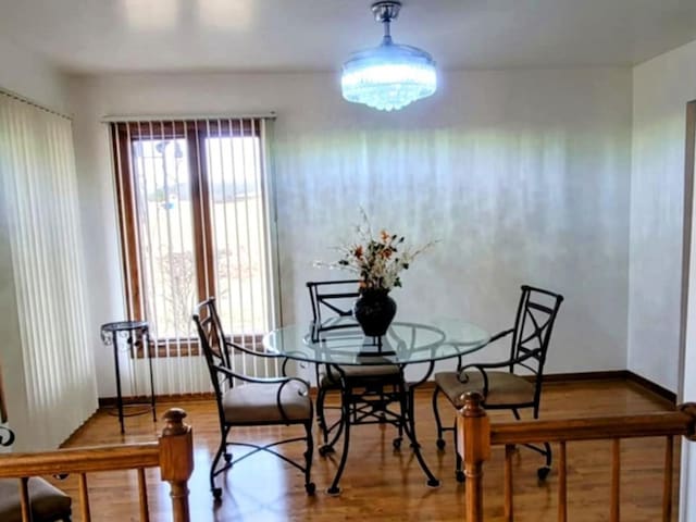 dining space featuring wood finished floors and baseboards