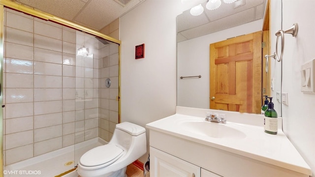 full bath with vanity, a shower stall, and toilet