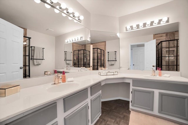 bathroom with vanity and tiled shower