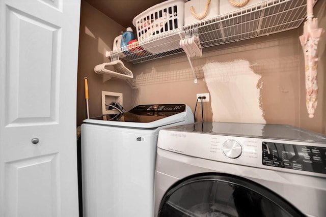 laundry room featuring washer and dryer and laundry area