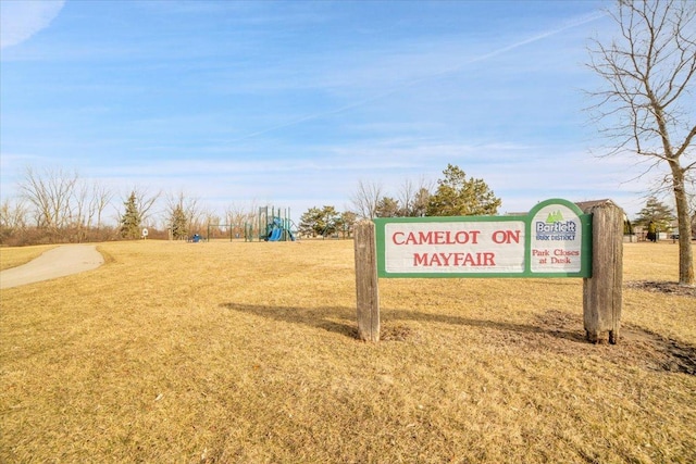 surrounding community with playground community and a lawn