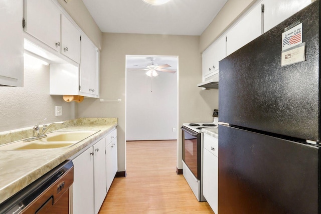 kitchen featuring freestanding refrigerator, a sink, range with electric cooktop, dishwasher, and under cabinet range hood