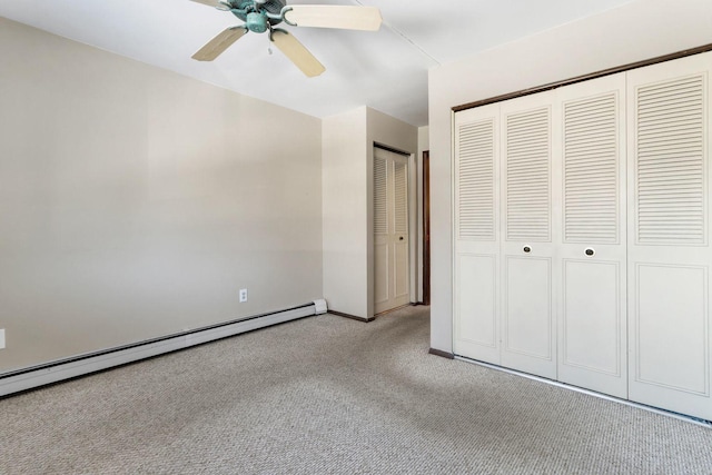 unfurnished bedroom featuring baseboards, a ceiling fan, baseboard heating, and carpet flooring