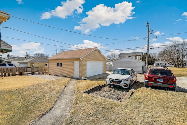 detached garage with fence