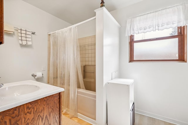 full bath with shower / tub combo with curtain and vanity