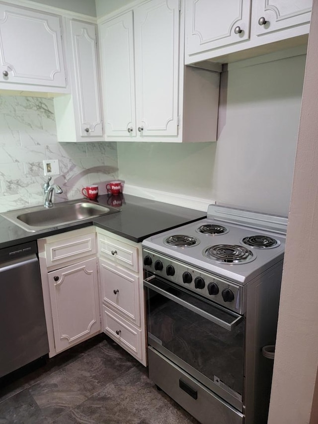 kitchen with a sink, decorative backsplash, range with electric cooktop, white cabinets, and stainless steel dishwasher