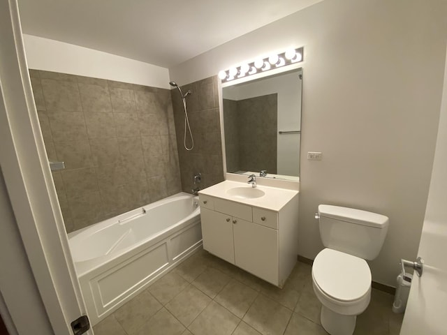 full bathroom featuring tile patterned flooring, toilet, vanity, baseboards, and shower / bathing tub combination