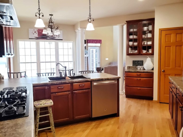 kitchen with decorative columns, hanging light fixtures, black gas cooktop, light wood-style floors, and dishwasher