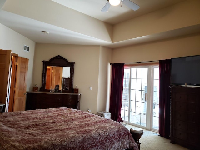 bedroom featuring visible vents, a ceiling fan, access to exterior, and carpet flooring