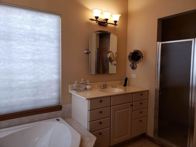 full bathroom featuring a stall shower, vanity, and a bath