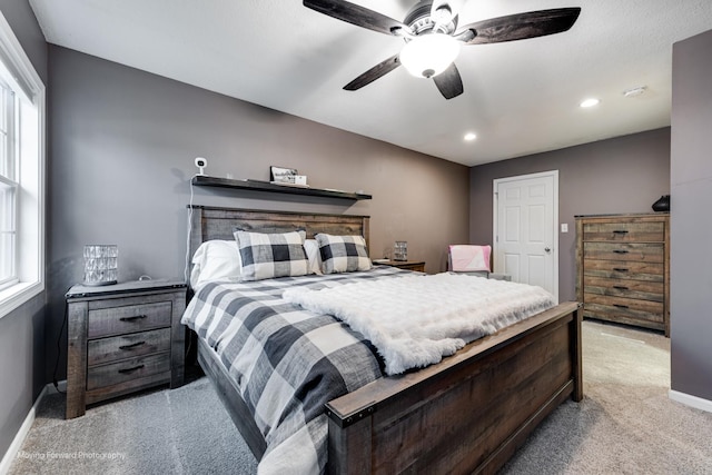 bedroom with light carpet, baseboards, a ceiling fan, and recessed lighting