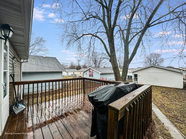 wooden deck featuring a grill