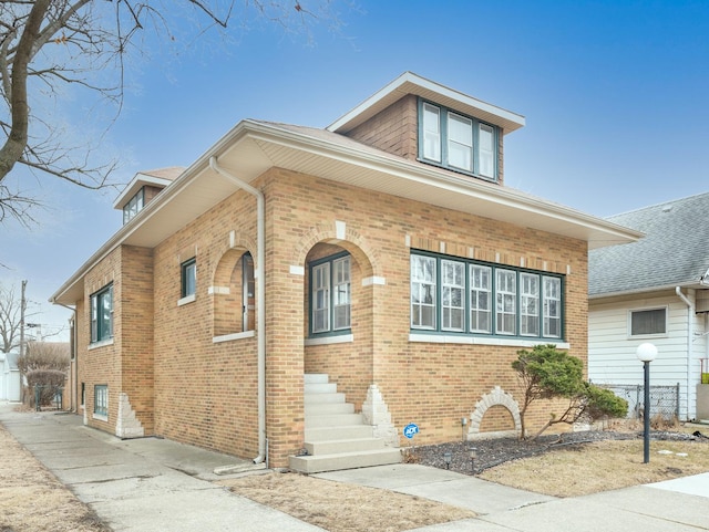 view of front of house featuring brick siding