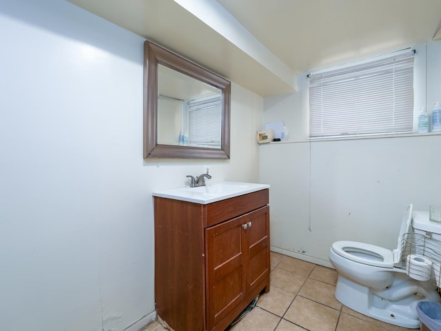 bathroom with tile patterned floors, toilet, and vanity