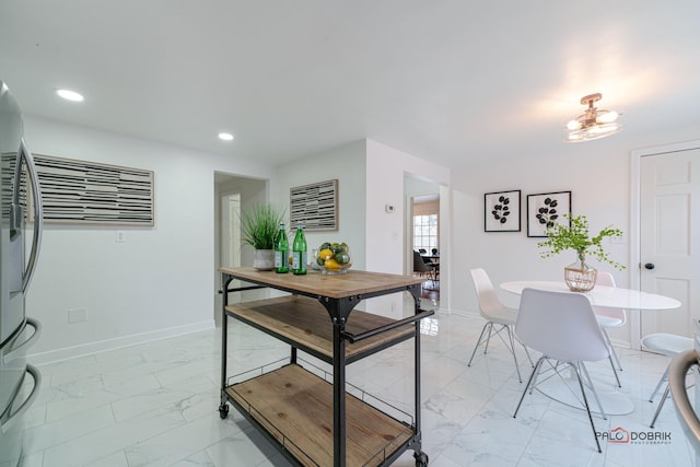 dining room with marble finish floor, recessed lighting, and baseboards