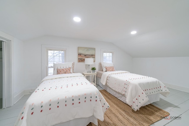 bedroom with vaulted ceiling, recessed lighting, and baseboards