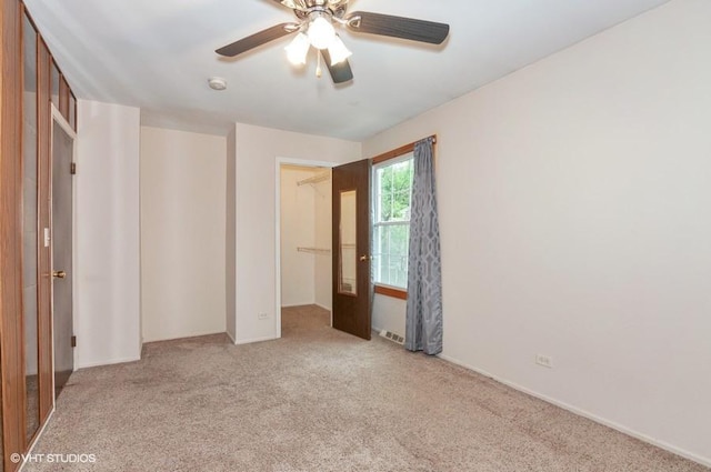 unfurnished bedroom with carpet flooring and a ceiling fan