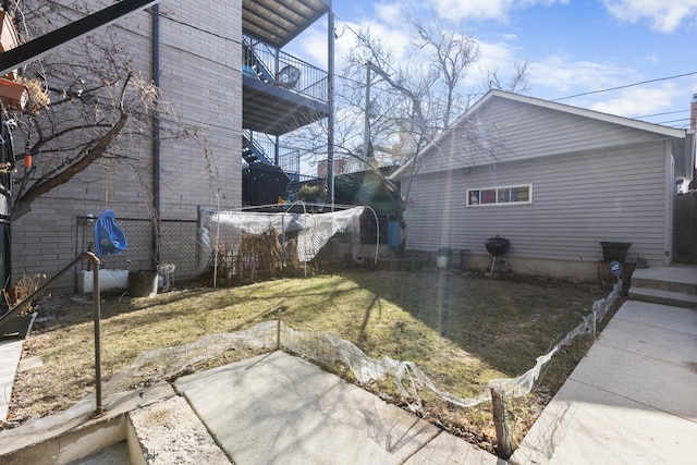 view of side of home with a lawn