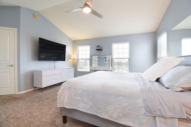 carpeted bedroom featuring lofted ceiling, a ceiling fan, and baseboards