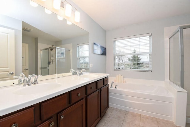 full bath with visible vents, a sink, a shower stall, tile patterned flooring, and a bath