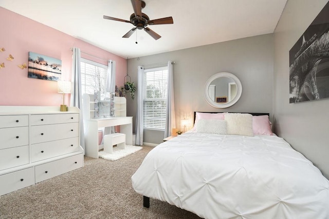 bedroom featuring light carpet and ceiling fan