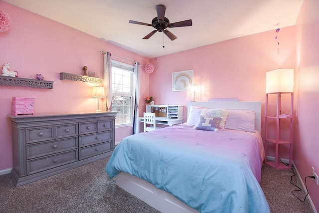 carpeted bedroom with a ceiling fan and baseboards