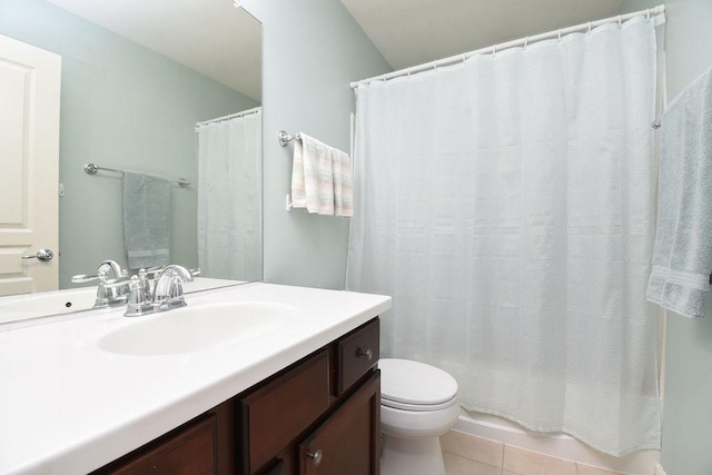 full bath with toilet, vanity, and tile patterned floors