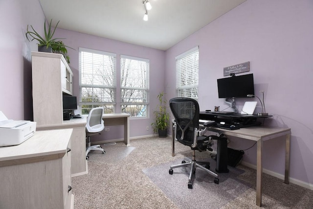 office area with rail lighting, light colored carpet, and baseboards