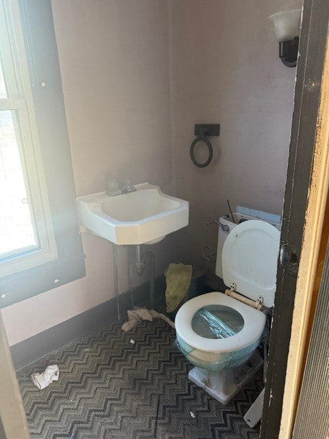 half bath with a sink and toilet