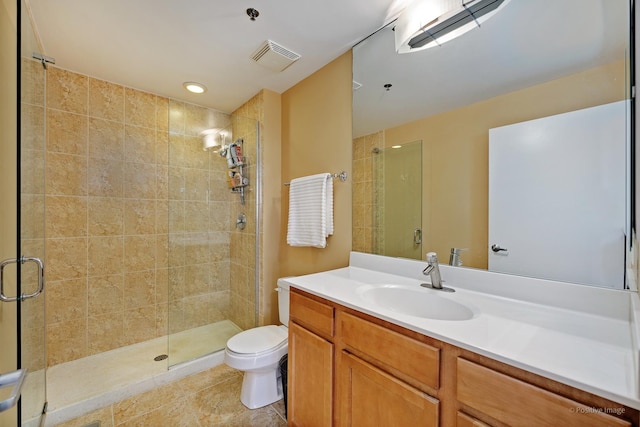 1841 S Calumet Ave Unit 1008, Chicago, IL 60616 - bathroom featuring toilet, a stall shower, vanity, and tile patterned floors