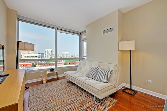 1841 S Calumet Ave Unit 1008, Chicago, IL 60616 - sitting room featuring wood finished floors, baseboards, and a city view