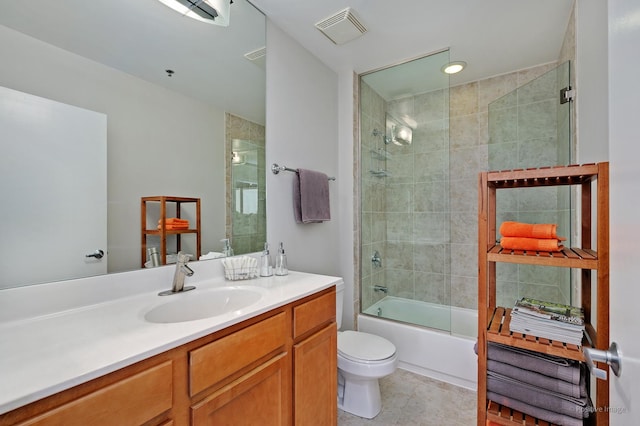 1841 S Calumet Ave Unit 1008, Chicago, IL 60616 - bathroom with vanity, toilet, shower / bath combination with glass door, and tile patterned floors