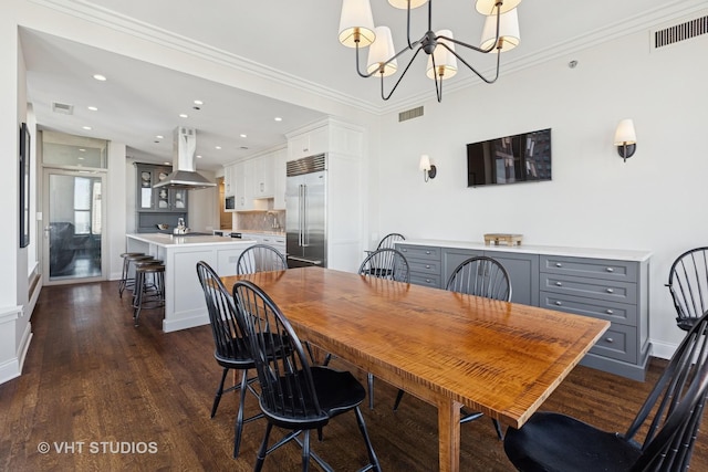 dining space featuring visible vents, baseboards, dark wood-style floors, and ornamental molding