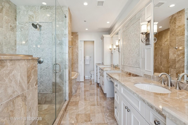 bathroom featuring a shower stall, visible vents, marble finish floor, and a sink