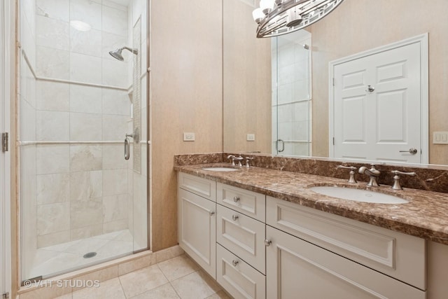 full bath featuring tile patterned flooring, a shower stall, double vanity, and a sink