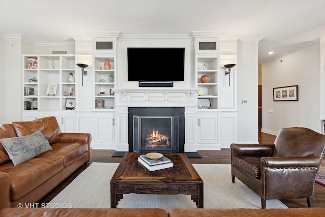 living area featuring ornamental molding, baseboards, dark wood-style flooring, and a lit fireplace