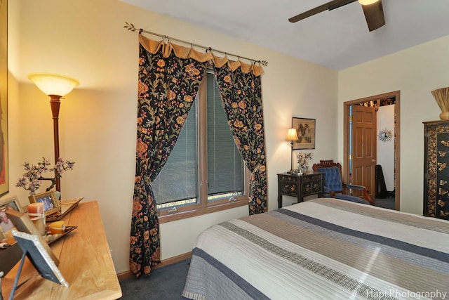 carpeted bedroom with baseboards and ceiling fan