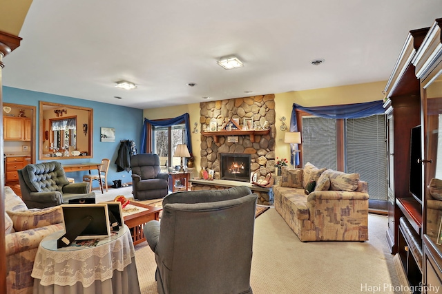 living area with a fireplace and carpet floors