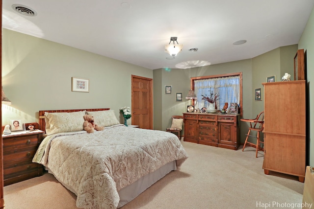 bedroom featuring visible vents and carpet floors