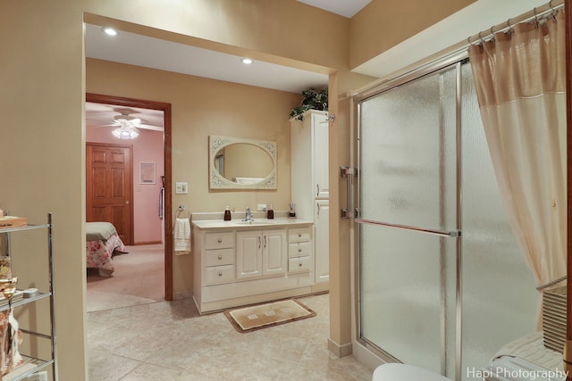 full bathroom with vanity, baseboards, recessed lighting, a stall shower, and connected bathroom