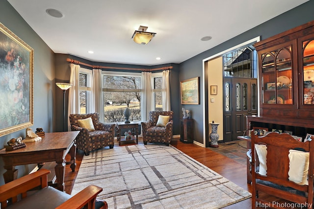 sitting room featuring recessed lighting, wood finished floors, and baseboards