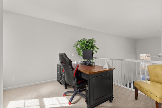 office space featuring light colored carpet and baseboards