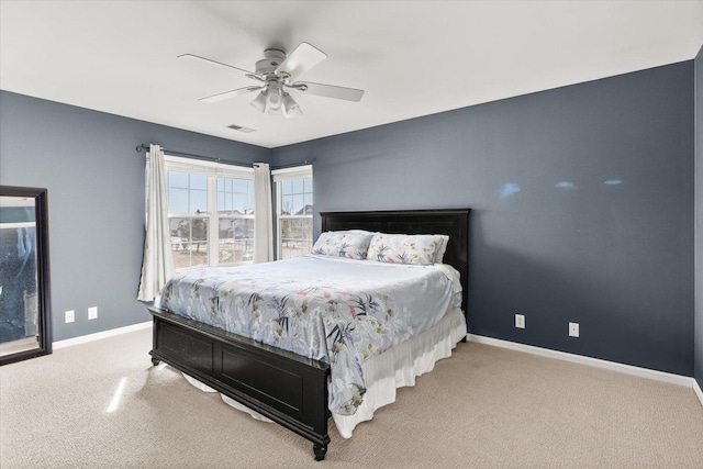 bedroom featuring visible vents, carpet, baseboards, and ceiling fan