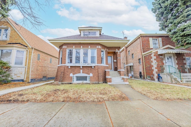 view of front of house with brick siding