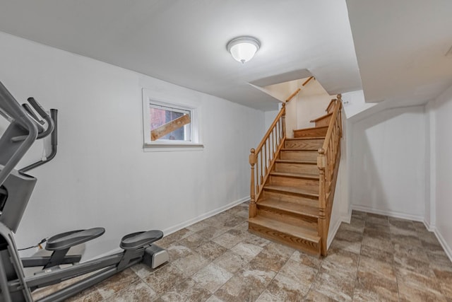 workout room with baseboards