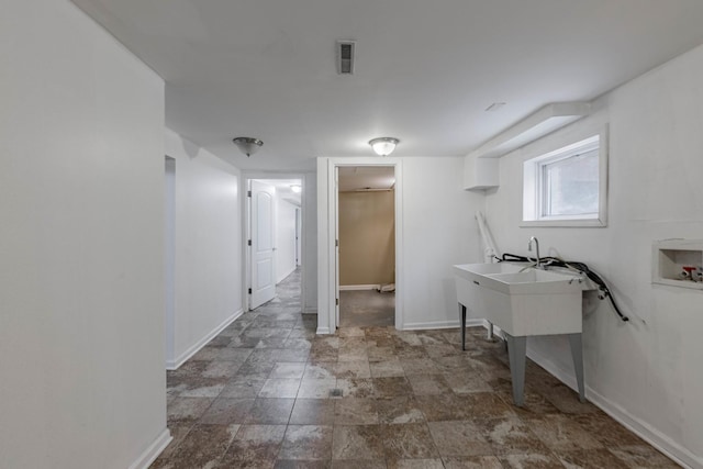 laundry room featuring washer hookup, visible vents, and baseboards