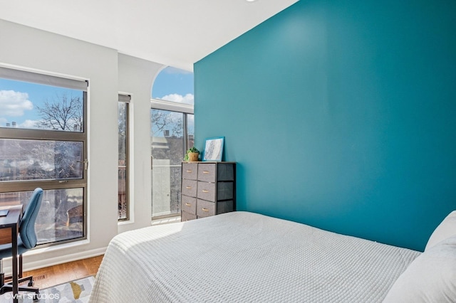 bedroom featuring wood finished floors